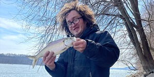 angler with hickory shad