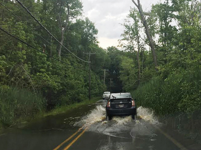 a Prius driving through high water.