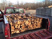 1/2 cord of firwood in an 8 ft. pick-up truck bed