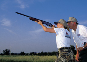 Class participant shooting clays.