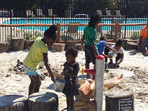 Children playing in sand pit at Constitution Gardens Park