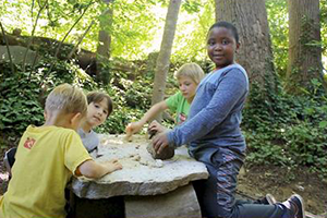 Playing on a Stone Table at Waldorf in the Woods