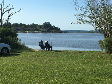 People fishing on the beach at the park