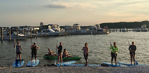 Kayakers along beach at Dundee Creek Marina