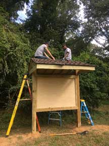 VCC members working on a park information sign