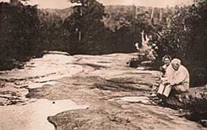 Thomas Edison and his wife, Mina Miller Edison, share a few contemplative moments along Muddy Creek upstream from the falls.