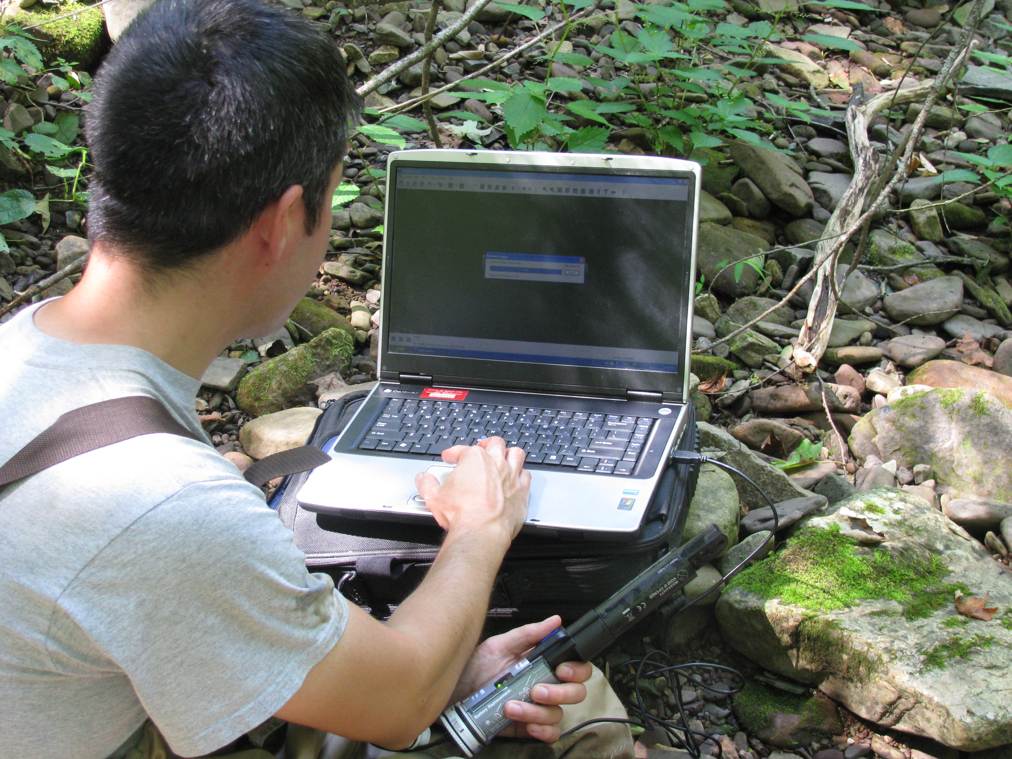 DNR biologist installing a conductivity logger