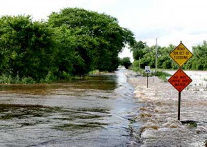 Runoff from a road spilling into a river