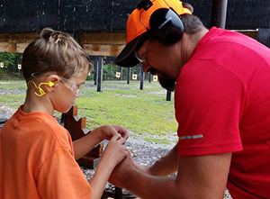 Youmg boy at shooting range